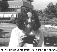 Xochitl examines her empty wallet outside Nettwerk.